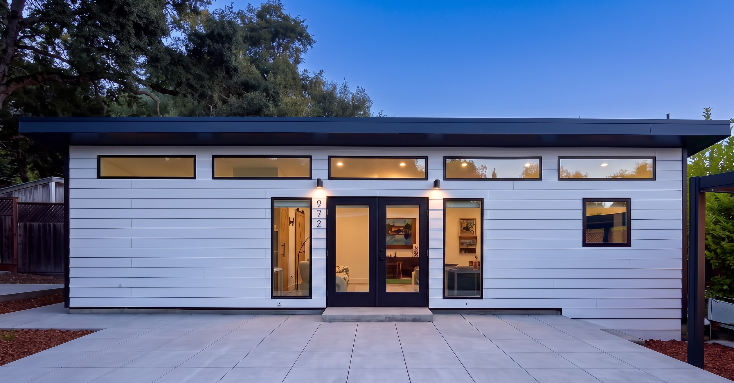 Twilight exterior and patio of the legal second residence at 972 Glenwood