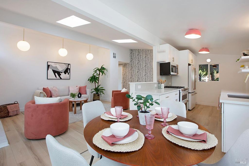 Dining area beneath open-beam ceilings at 970 Glenwood Drive