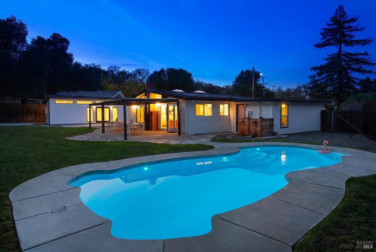Pool at dusk beneath the oaks at 970 Glenwood Drive